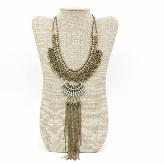 Antique Gold Statement Necklace on a beige neckform with a white background