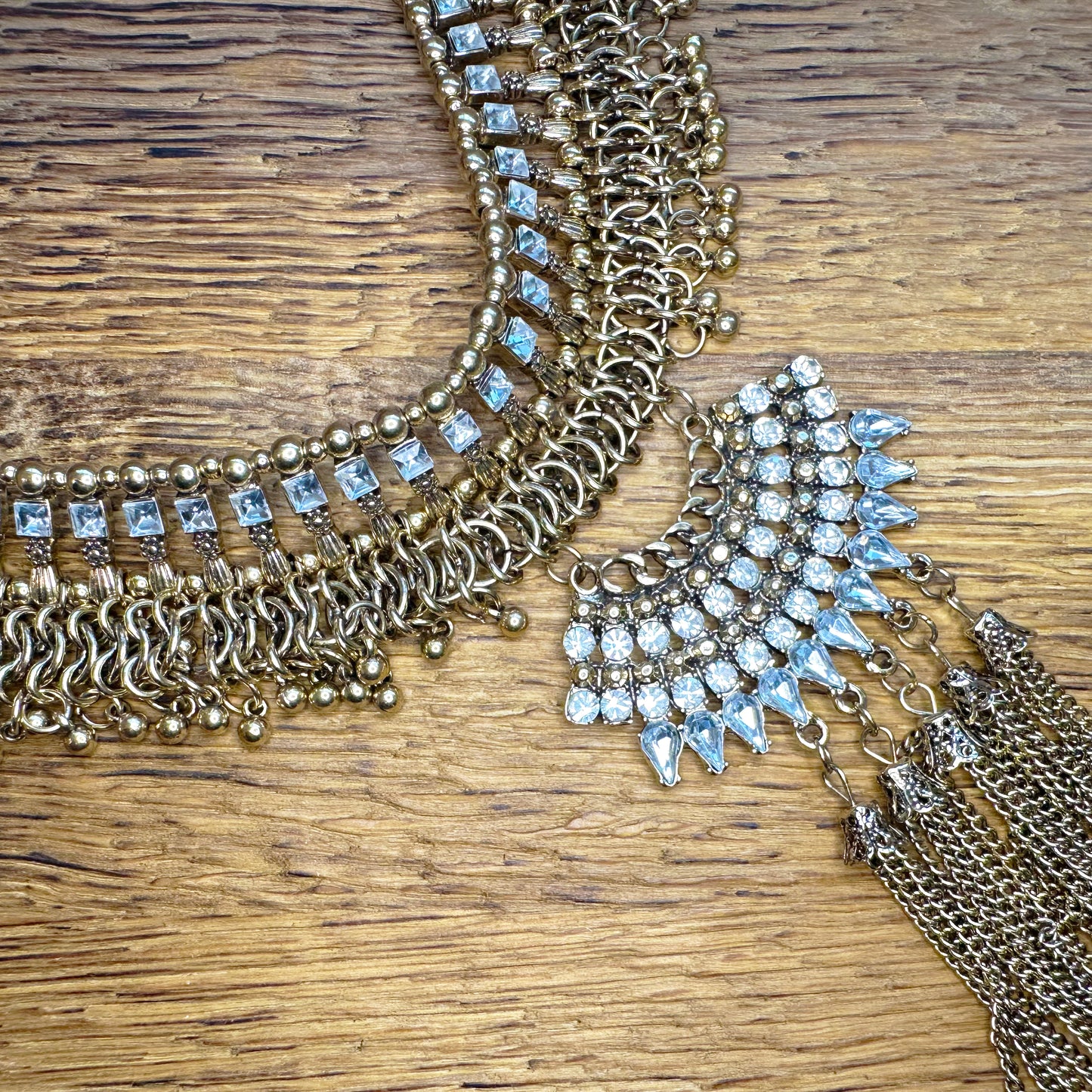 Detail view of a gold and rhinestone statement necklace