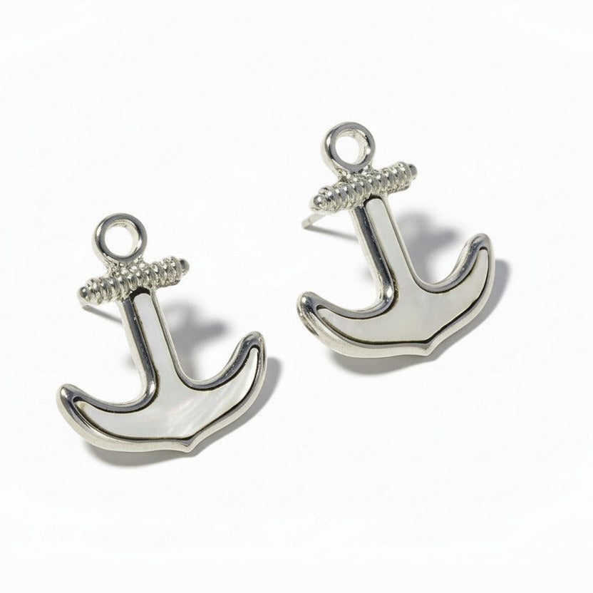 Silver anchor earrings on a white background
