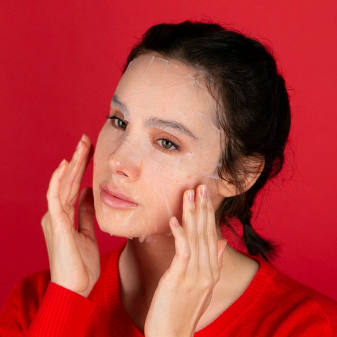 photo of woman wearing sheet mask