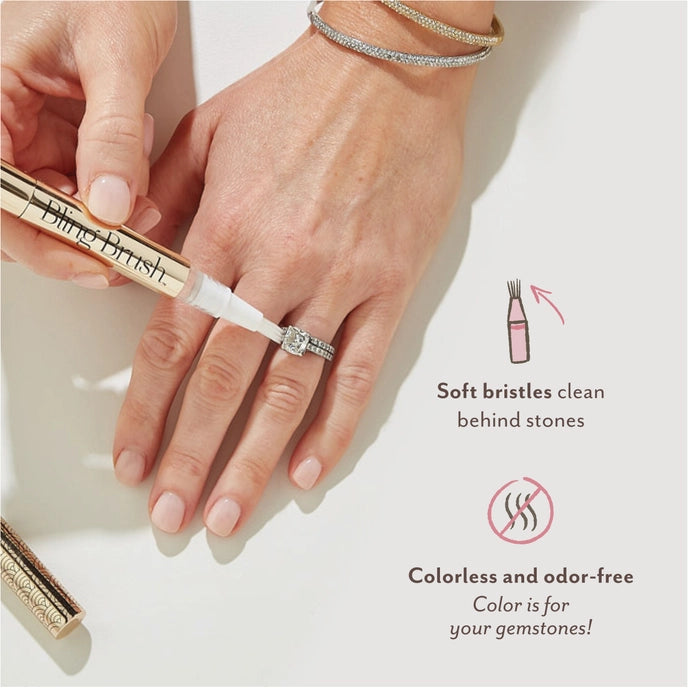 photo of hand with ring using bling brush