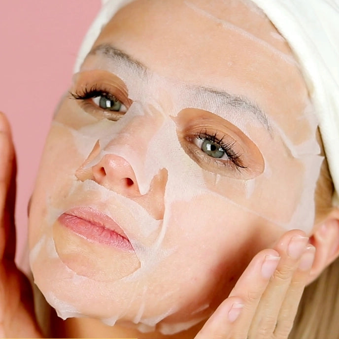 photo of woman wearing sheet mask