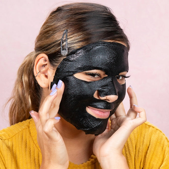 photo of woman wearing sheet mask