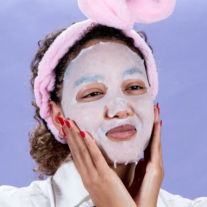 photo of woman wearing sheet mask