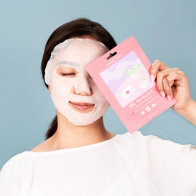 photo of woman wearing sheet mask
