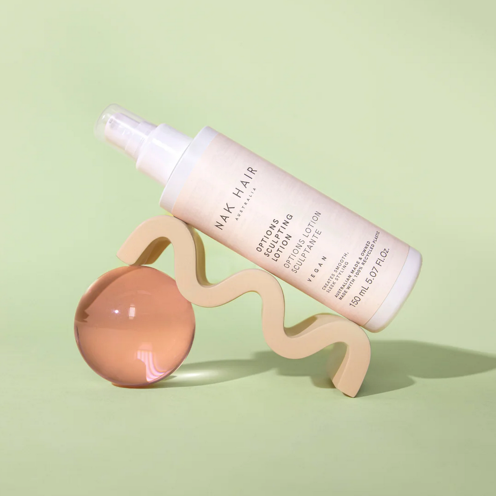 Decorative photo of Options Sculpting Lotion bottle.