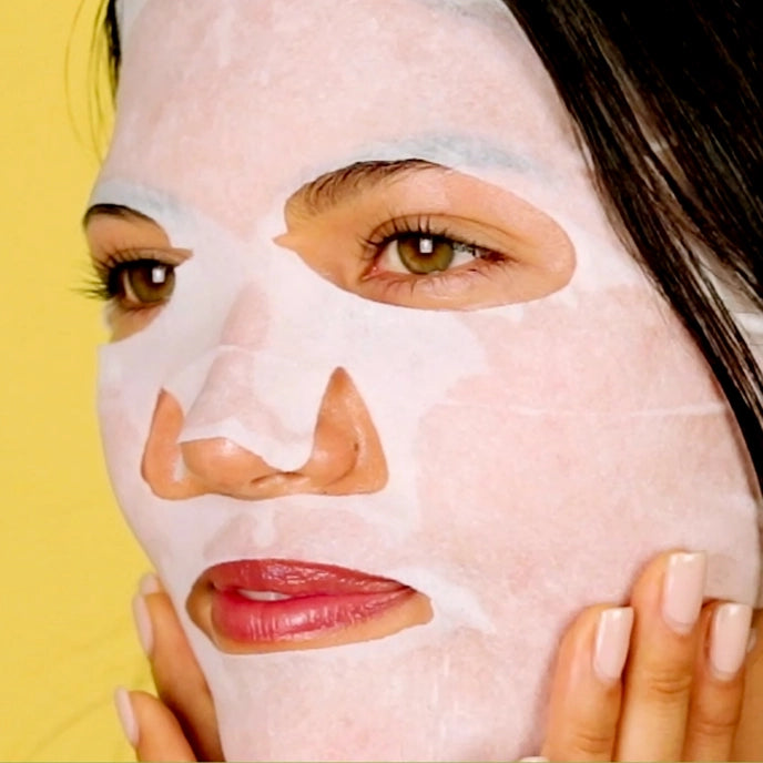 photo of woman wearing sheet mask