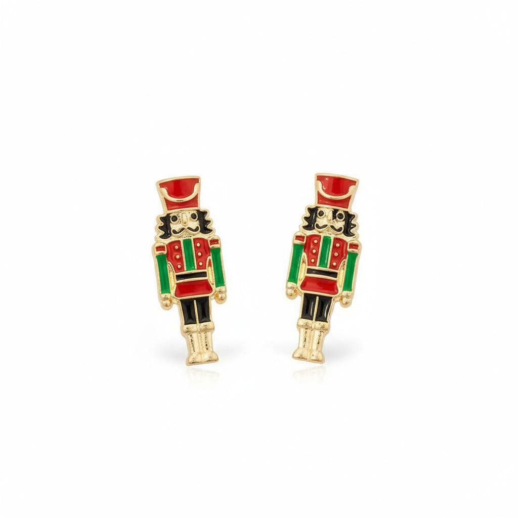 Set of Nutcracker-themed earrings on a white background.
