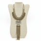 Antique Gold Statement Necklace on a beige neckform with a white background
