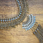 Detail view of a gold and rhinestone statement necklace