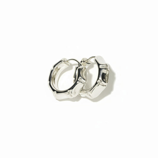 Silver bamboo style hoop earring on a white background