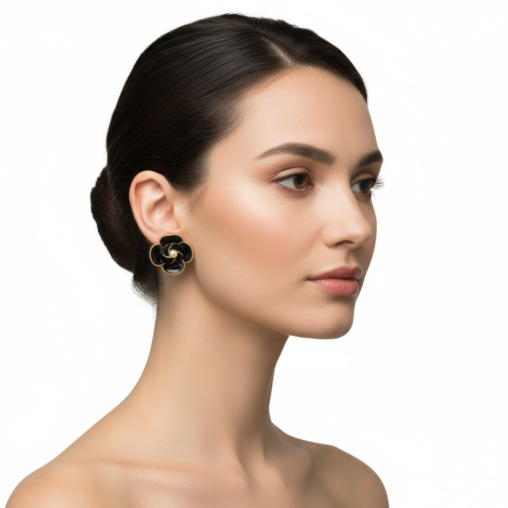 Black flower-shaped earring on a woman