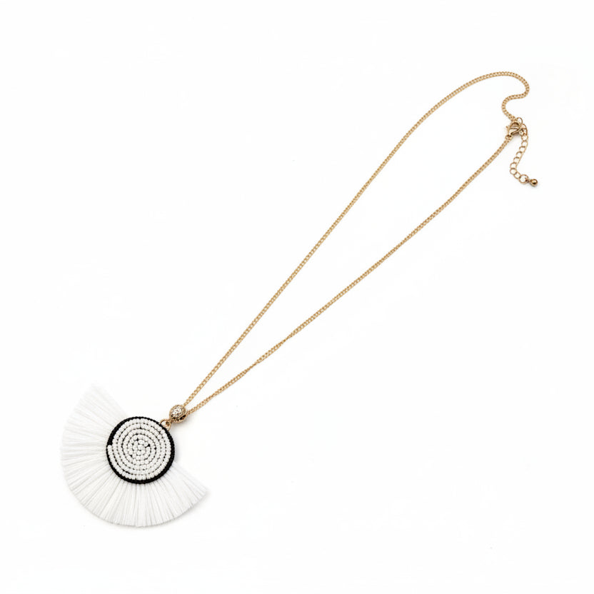 Necklace with a decorative pendant on a white surface