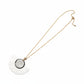Necklace with a decorative pendant on a white surface