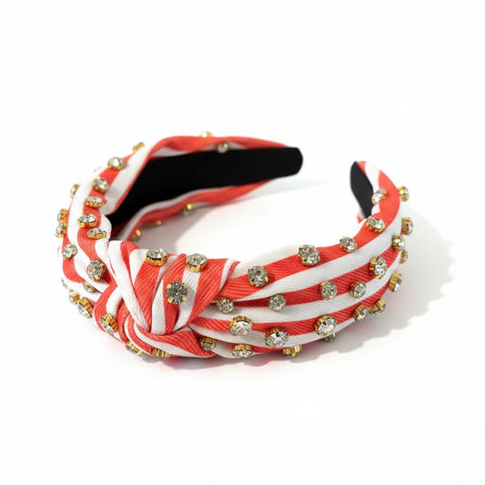 Orange and white stripe headband with rhinestone embellishments.