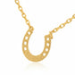 Gold horseshoe necklace on a white background