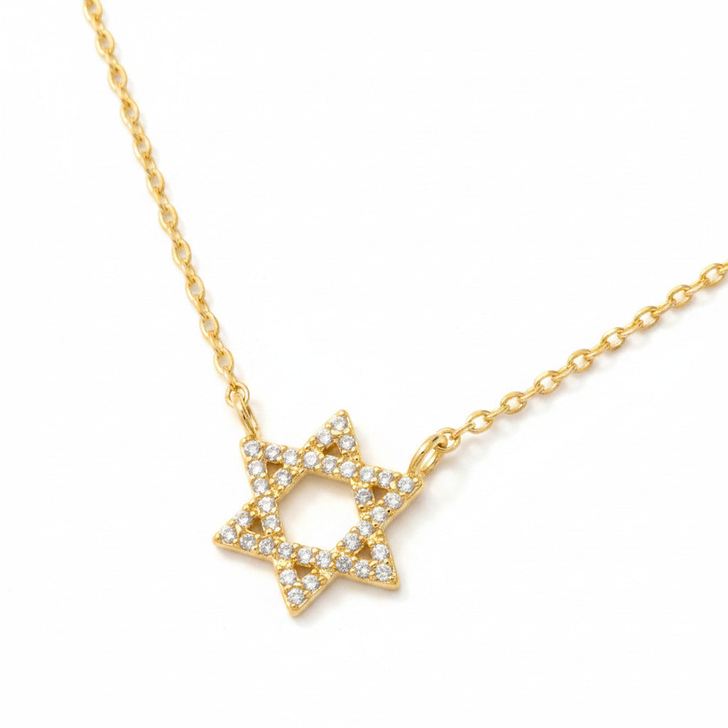 Gold necklace with a Star of David on a white background