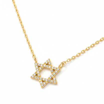 Gold necklace with a Star of David on a white background