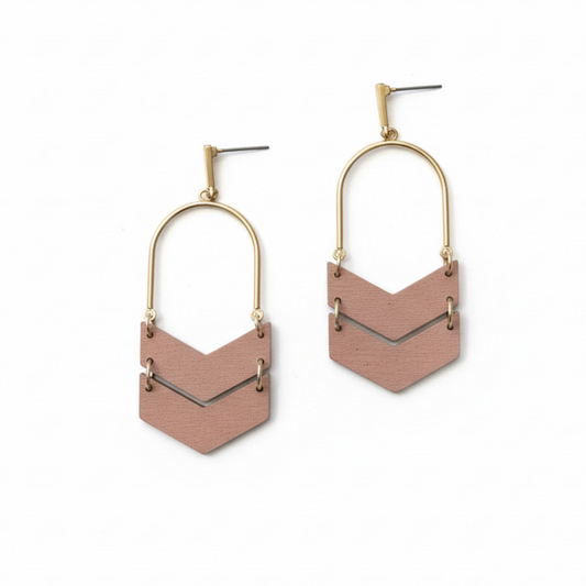 Pair of earrings with neutral geometric designs on a white background