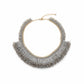 gold necklace with gray fringe and beading against a white background