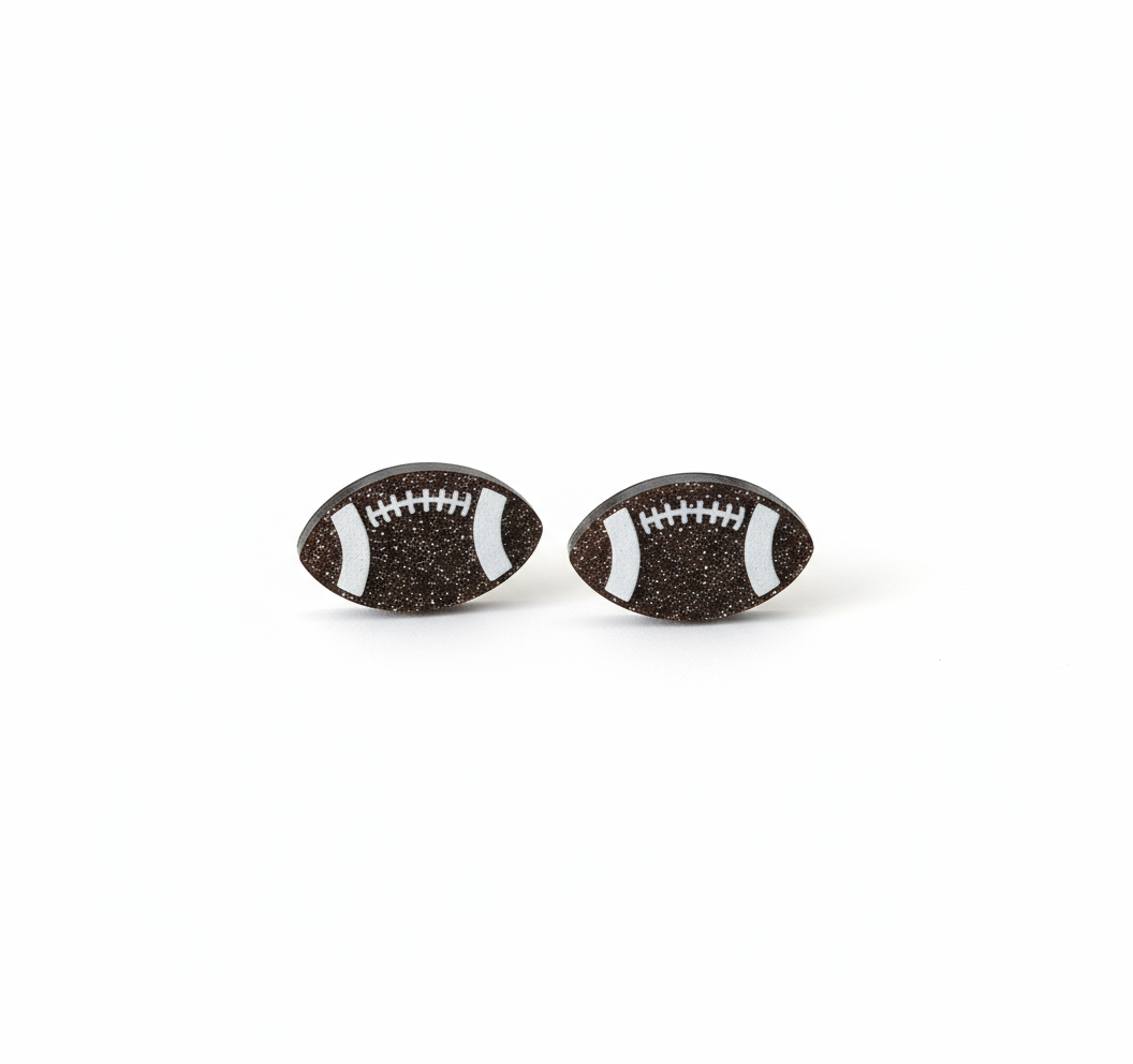Football earrings on a football field with a white background