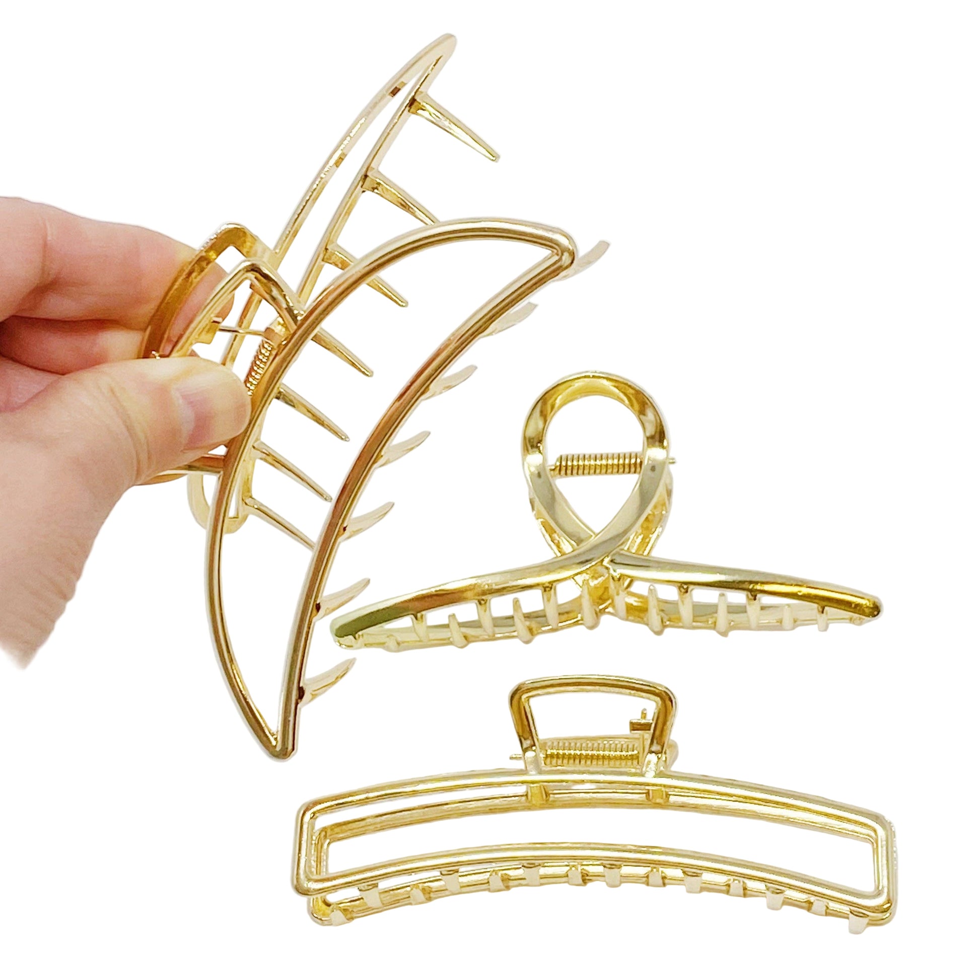 Gold hair clips on a white background