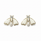 Pair of bee-shaped earrings with pearl accents on a wooden surface