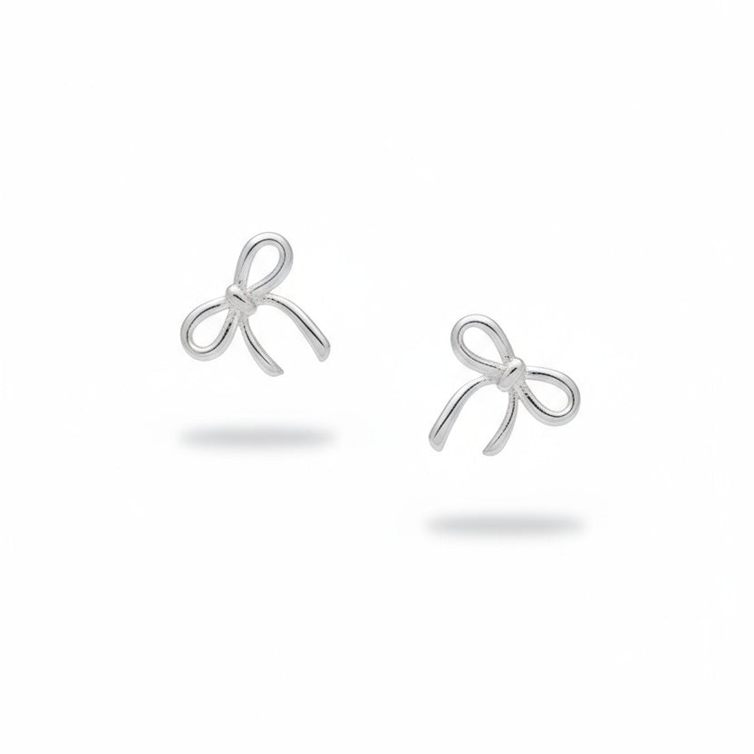 Pair of rhodium-plated bow-shaped earrings on a white background
