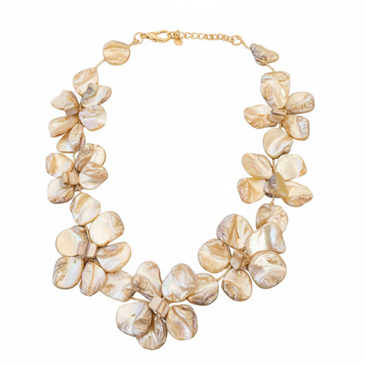 Shell floral necklace on a white surface