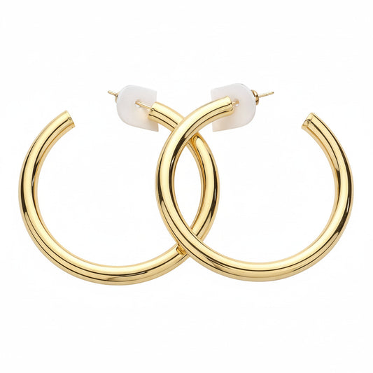 Gold hoop earrings on a white background