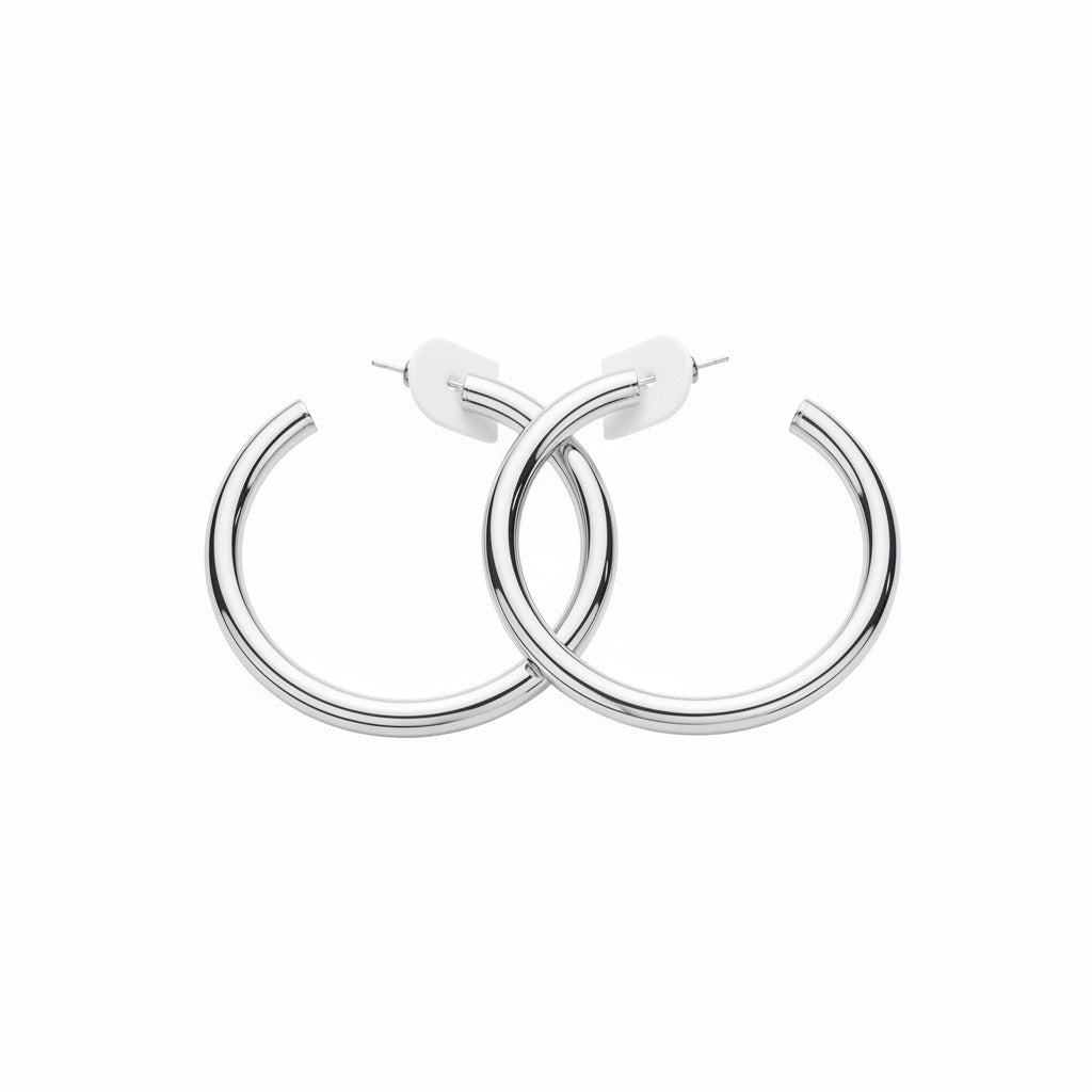 Silver hoop earrings on a white background