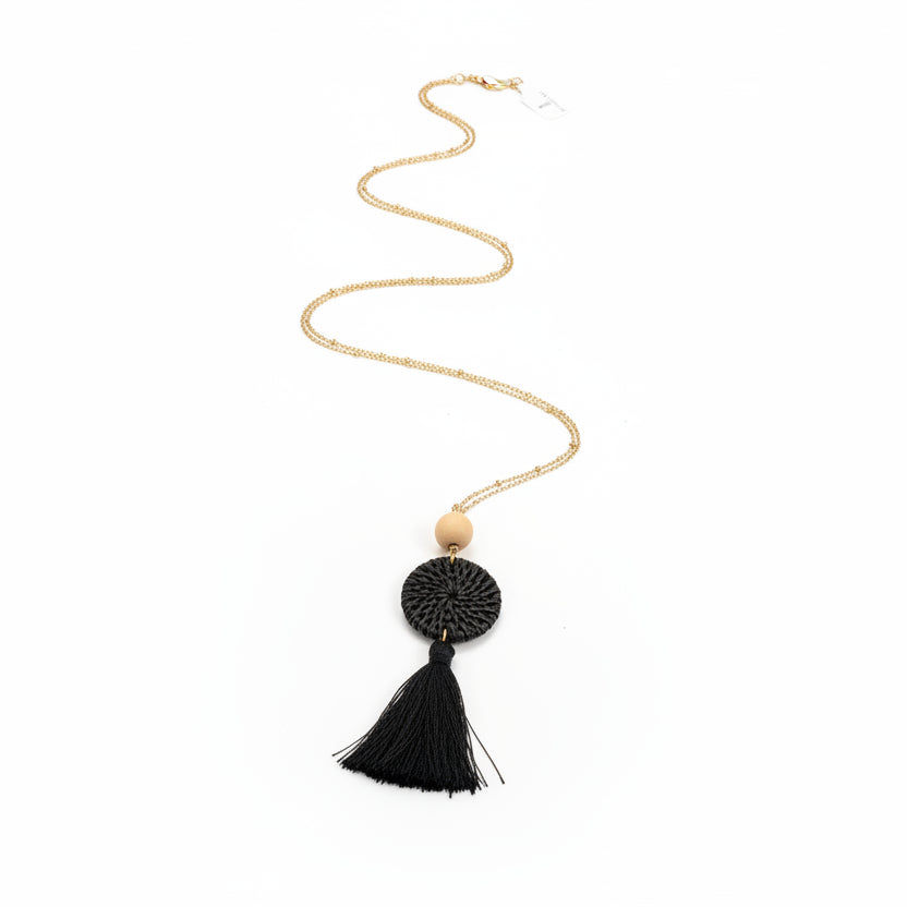 Black tassel necklace on a white  background