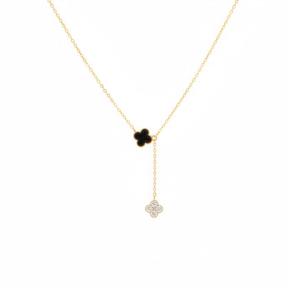 Gold necklace with a clover-shaped pendant on a white background.