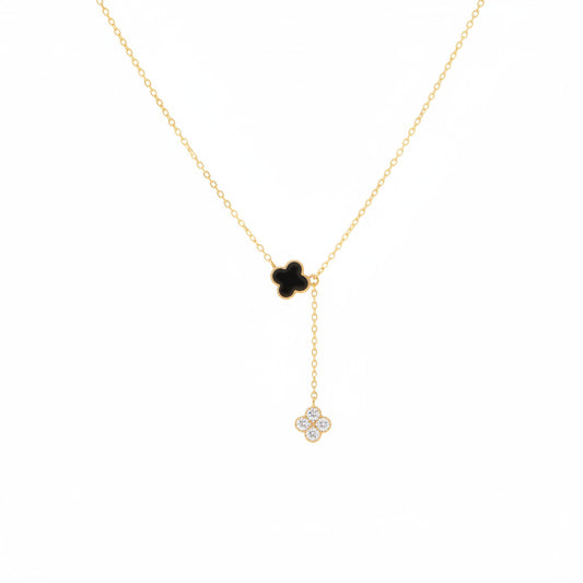 Gold necklace with a clover-shaped pendant on a white background.