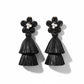 Black raffia earrings with floral tops on a white background