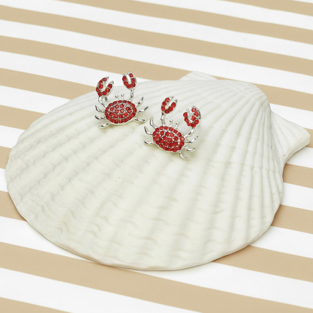 Seashell with red crab design on a striped background
