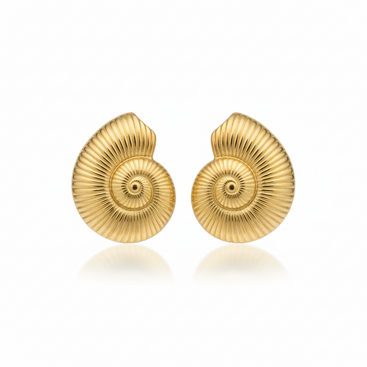 Gold shell earrings on a white background