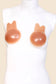 White sleeveless mannequin with silicone breast forms on a beige background