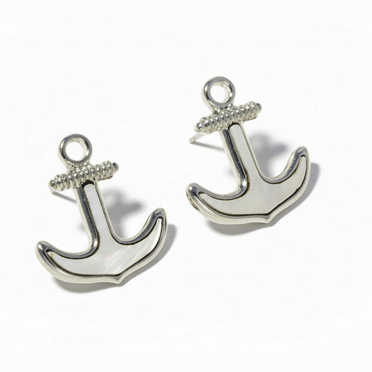Silver anchor earrings on a white background