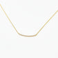 gold necklace with pave rhinestones on a white background