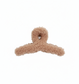 fuzzy tan hair clip on a white background