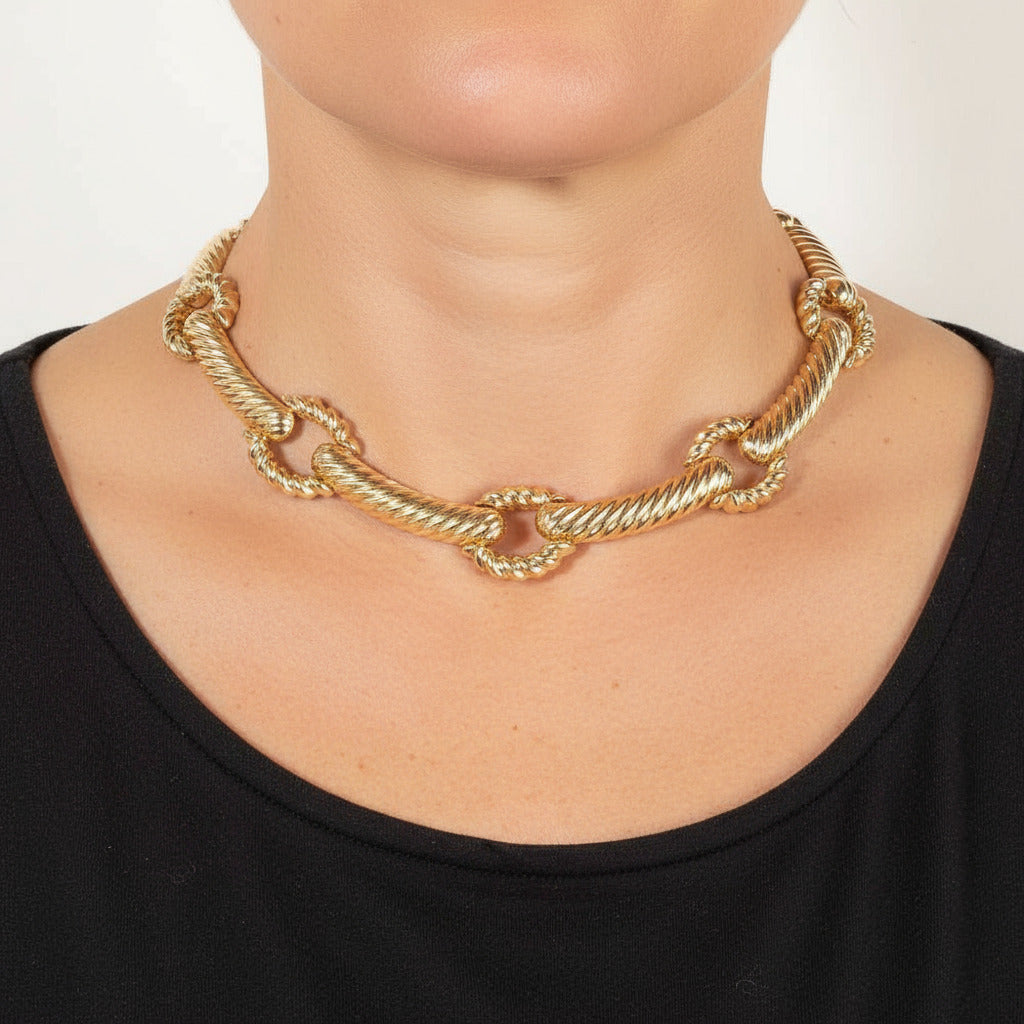 Gold chain necklace on a woman