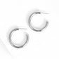 Silver hoop earrings on white background
