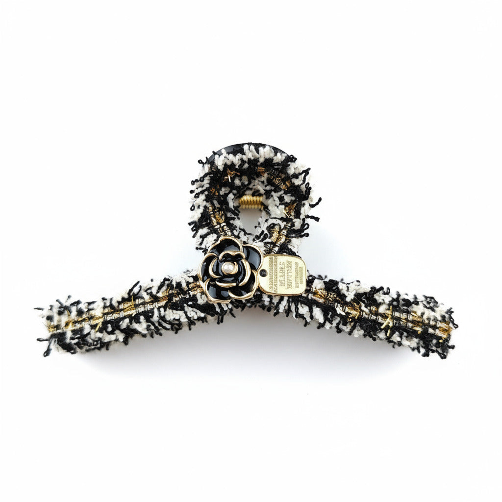 tweed and flower claw clip on white background