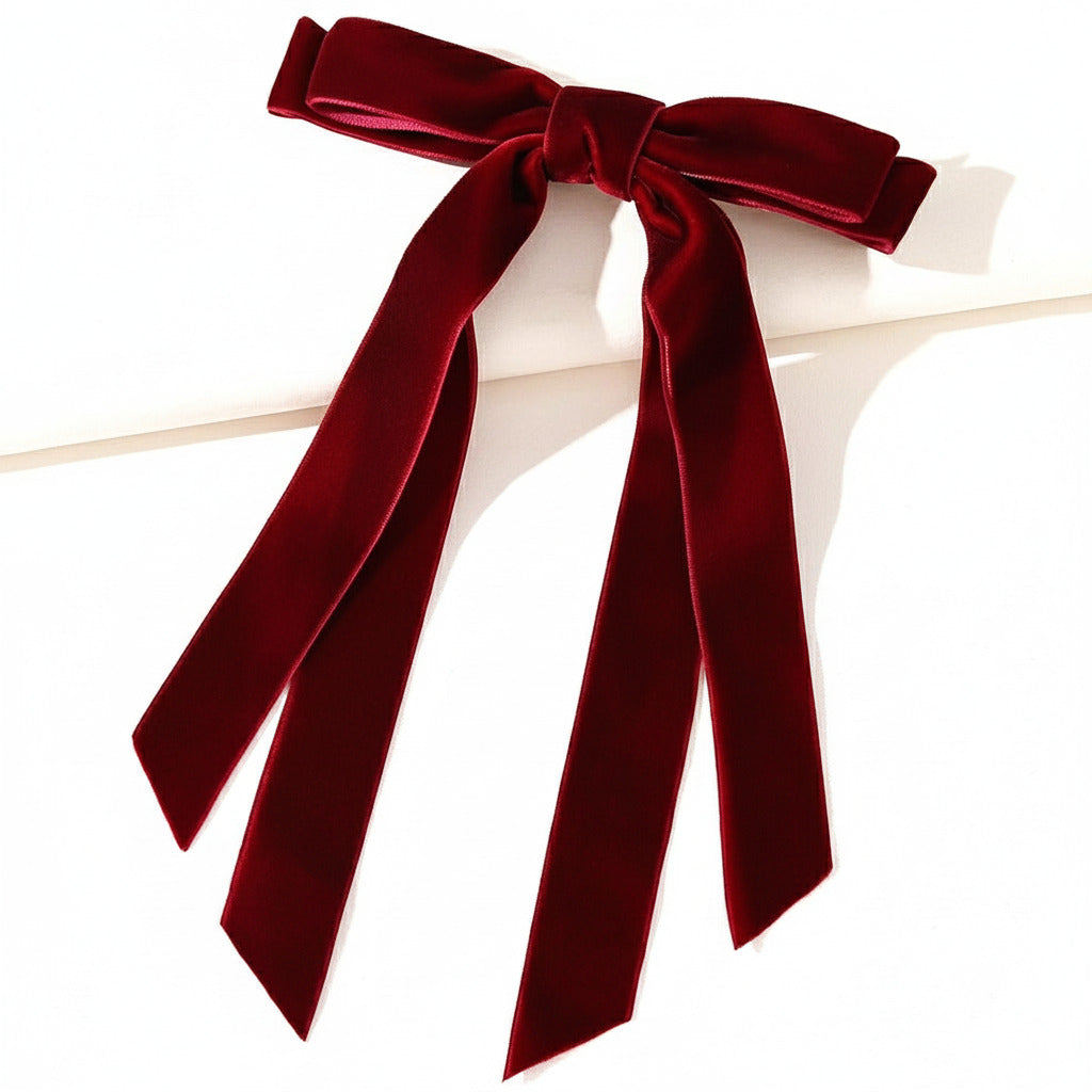 Red velvet bow on a white background
