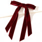 Red velvet bow on a white background