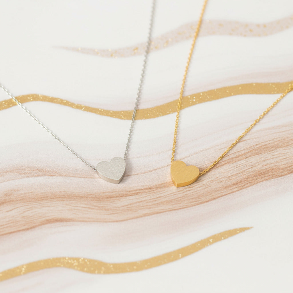 Heart-shaped necklaces in gold and silver.