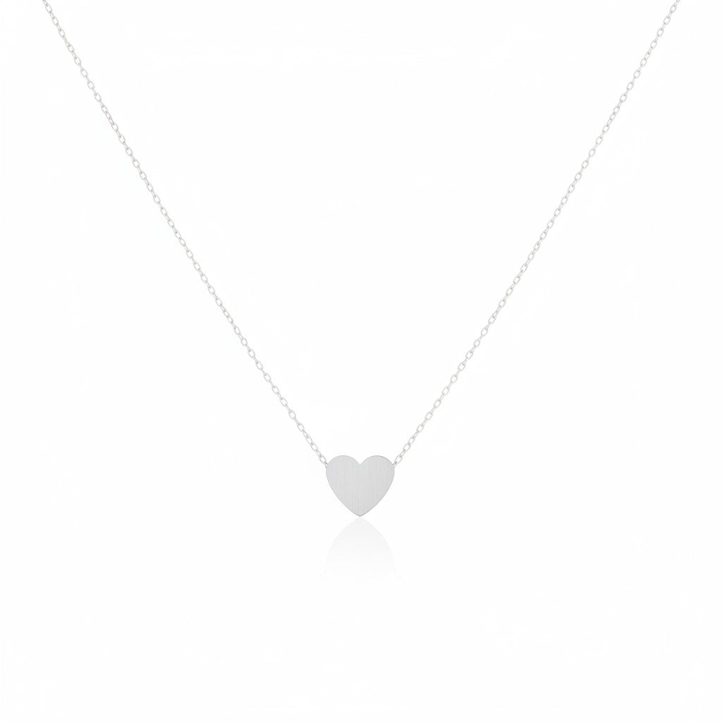 Silver heart necklace on a white background