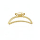 Gold hair clip on a white background