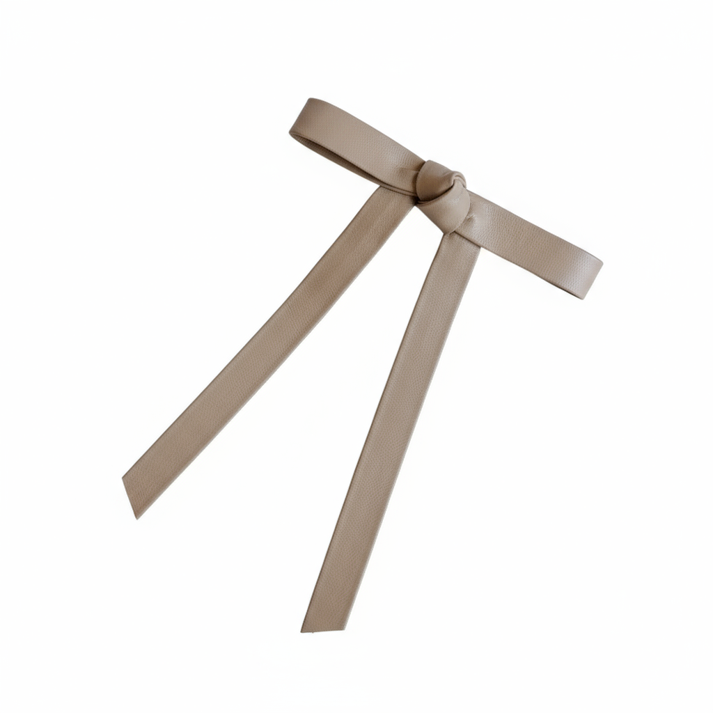 Taupe leather hair bow on white background